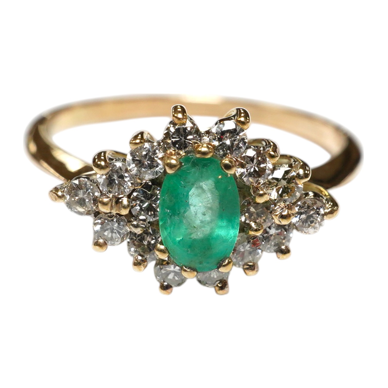 A yellow metal, emerald and diamond cluster set navette shaped ring, size P, gross weight 2.3 grams. Condition - fair to good